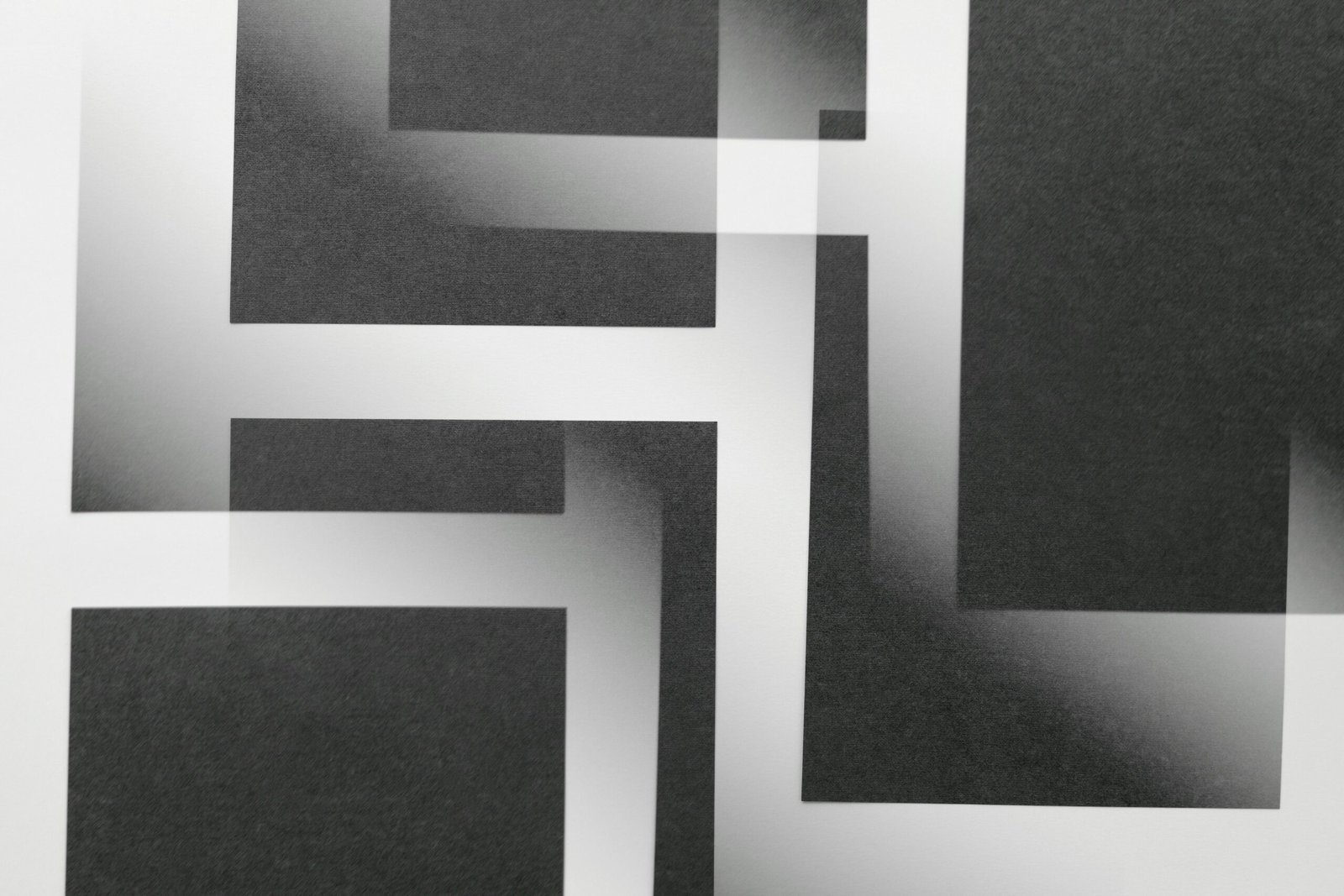 Abstract black and white geometric design with overlapping rectangles creating a modern artistic pattern.